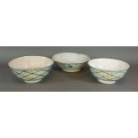 A pair of delft bowls with underglaze blue and green decoration, 16cms diameter, together with