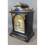 An early 20th Century ebonised and brass mounted bracket clock, the brass dial with silvered chapter
