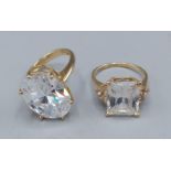 A 14ct gold dress ring set large clear stone together with another similar 14ct gold dress ring