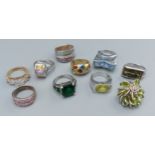 A collection of mainly silver dress rings to include a multi stone set ring