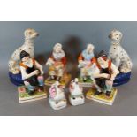 A set of four Staffordshire figures together with other related ceramics