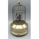 An musical automaton bird cage with singing bird, 23cms tall