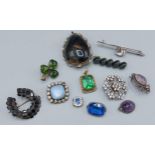 A collection of brooches and pendants to include two bar brooches