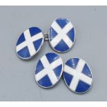 A pair of sterling silver and enamel decorated cuff links in the form of the Scottish flag