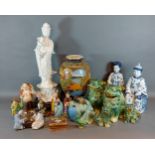 A large Blanc De Chine figure together with other related ceramics