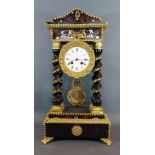 A 19th Century French ebonised and brass mounted Portico clock, the circular enamel dial with
