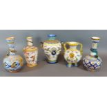 A pair of Majolica bottle neck vases, 18cms tall together with three similar Majolica vases