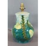 A Moorcroft Banksia pattern table lamp of bulbous form, 30cms tall