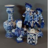 A Delft blue and white decorated bottle neck vase together with a similar group, a bust and a