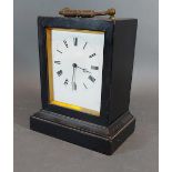 A 19th Century ebonised small table clock, the enamel dial with Roman numerals,15cms tall