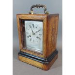 A 19th Century French marquetry inlaid table clock, the silvered dial with Roman numerals and with