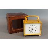 A brass cased carriage clock with leather carrying case