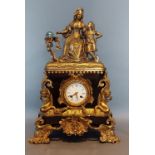 A 19th Century French Ormolu mantle clock, the surmount in the form of a Mother and child, the