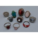 A collection of silver dress rings to include two locket rings