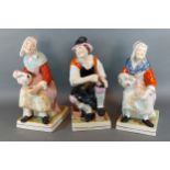 A 19th Century Staffordshire figure 'The Cobbler' together with a similar pair of Staffordshire