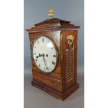 A Regency rosewood and brass inlaid bracket clock, the case with pineapple finial and side ring