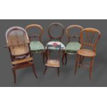 A pair of Victorian balloon back side chairs together with another similar, a correction chair and a