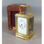 A 19th Century French brass Carriage clock with lever escapement and leather carrying case