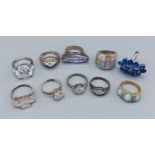 A collection of ten silver dress rings set with various stones
