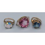A 9ct gold dress ring set Topaz together with another 9ct gold Topaz set ring and a 9ct gold Topaz