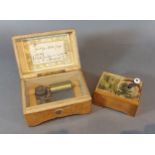 An early 20th Century rectangular musical box together with another similar