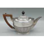 A Victorian silver teapot of half lobed form, Sheffield 1891, 16ozs