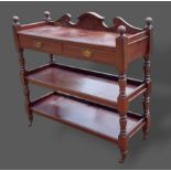 A Victorian mahogany buffet with two frieze drawers above turned uprights, 119cms wide, 44cms deep