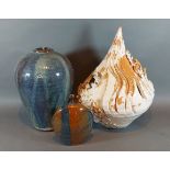 A studio pottery vase with mottled blue ground, 29cms tall together with another similar moon