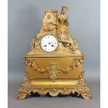 A 19th Century French ormolu mantle clock with figural surmount, the enamel dial with Roman numerals