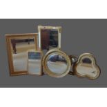 A 20th Century convex style wall mirror together with six gilt framed wall mirrors