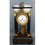 A 19th Century French ebonised and brass mounted Portico clock, the circular enamel dial with