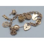 A 9ct gold charm bracelet with padlock clasp, with many charms to include a crown, 22gms