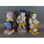 A French Faience character jug 'The Snuff Taker', 27cms tall together with two similar Faience