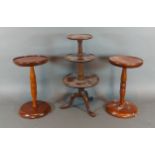 A miniature three tier dumb waiter together with a pair of wig stands