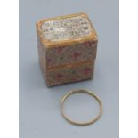 An early 19th Century gold wedding band, possibly within original box, 0.7gms