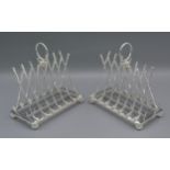 A pair of six division toast racks in the form of golf clubs and balls, 15cms tall