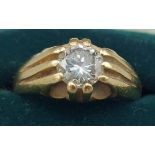 An 18ct gold solitaire diamond gypsy ring, claw set, approx. 1.1ct, 11gms, ring size R