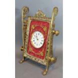 A late 19th Century French brass Easel clock of pierced form, the circular dial with Roman numerals,