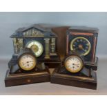 A Victorian black slate mantle clock together with three other similar black slate mantle clocks