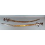 A 19th Century Indian Tulwar together with another similar Indian Tulwar, lengths of blades, 89cms