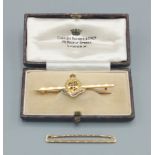 A 9ct gold and enamel Medical Army Corps bar brooch together with a 9ct gold tie pin, 4.8gms