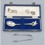 A London silver commemorative spoon together with a pair of silver sugar tongs and two pairs of