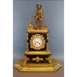 A 19th Century French Ormolu mantle clock, mounted with a figure in the form of a Cavalier, the