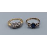 A 9ct gold diamond cluster ring together with another 9ct gold three stone dress ring, 6.2gms,