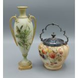 A Royal Worcester two handled vase hand painted with butterfly amongst foliage, highlighted with