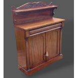 A William IV mahogany chiffonier, the low shelf back above a concealed frieze drawer and two