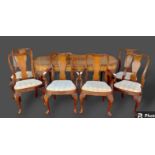A 1920's Queen Anne style walnut dining room suite comprising an extending dining table with extra