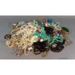 A collection of costume jewellery to include necklaces, brooches and other jewellery