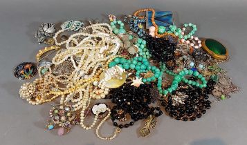 A collection of costume jewellery to include necklaces, brooches and other jewellery