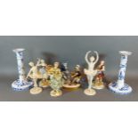 A pair of candlesticks by Villeroy and Boch together with six German figures